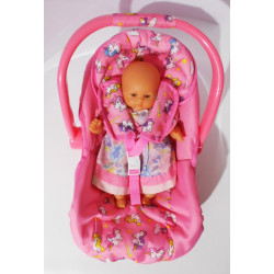 Poupée avec cosy /siège auto